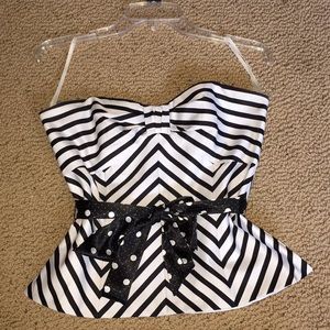 Adorable striped shirt with a polkadot belt.